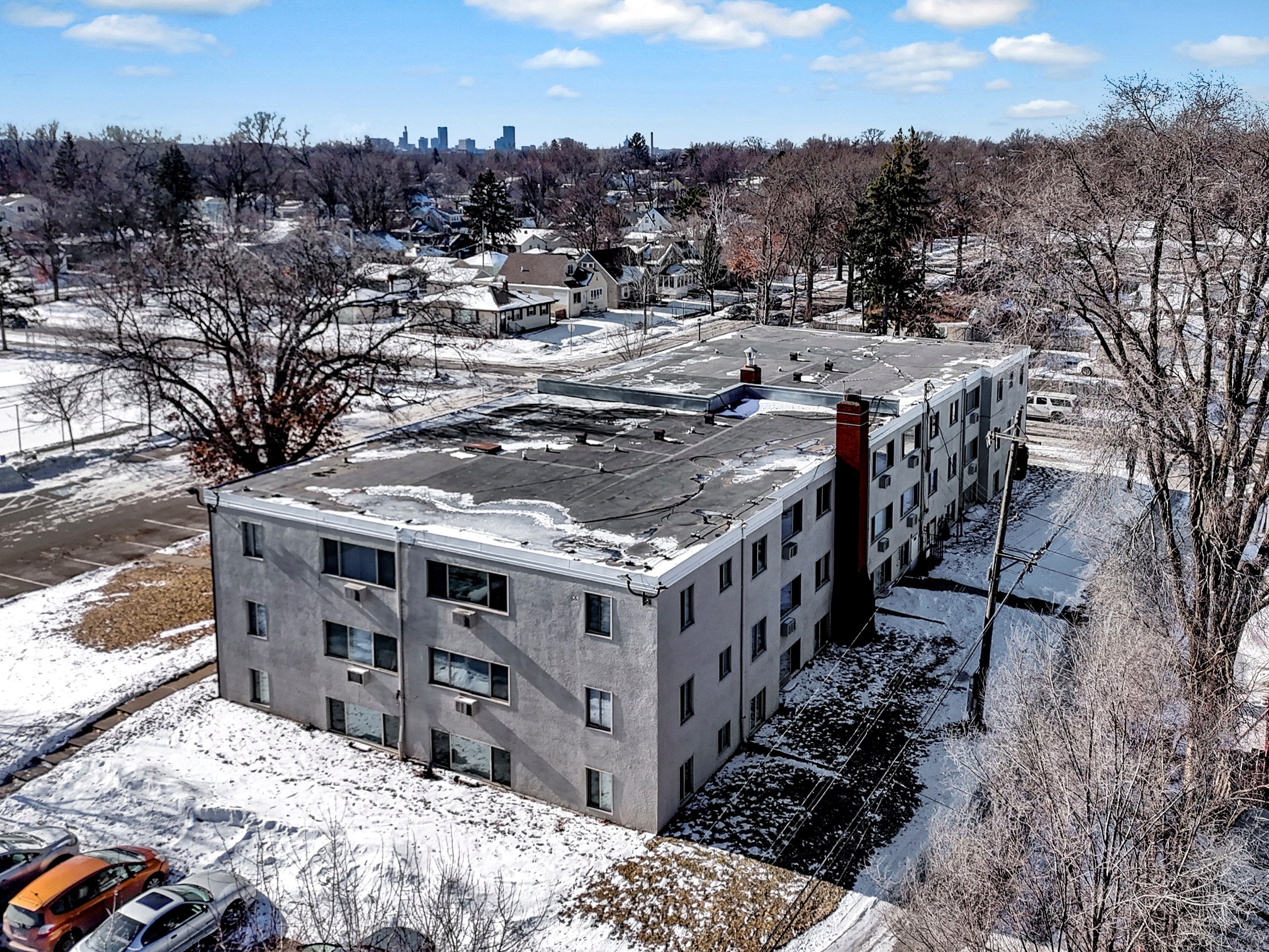 Aerial of a Verus Praedium building with the Minneapolis skyline beyond