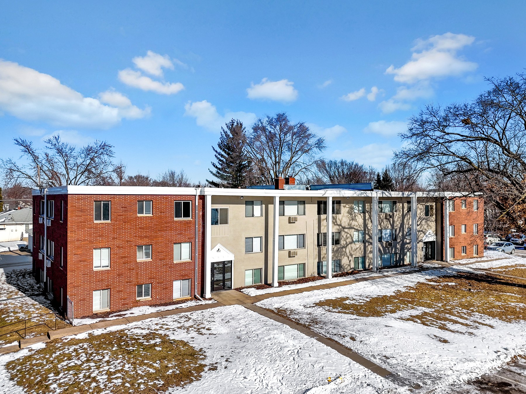 A Verus Praedium apartment building under a clear winter sky