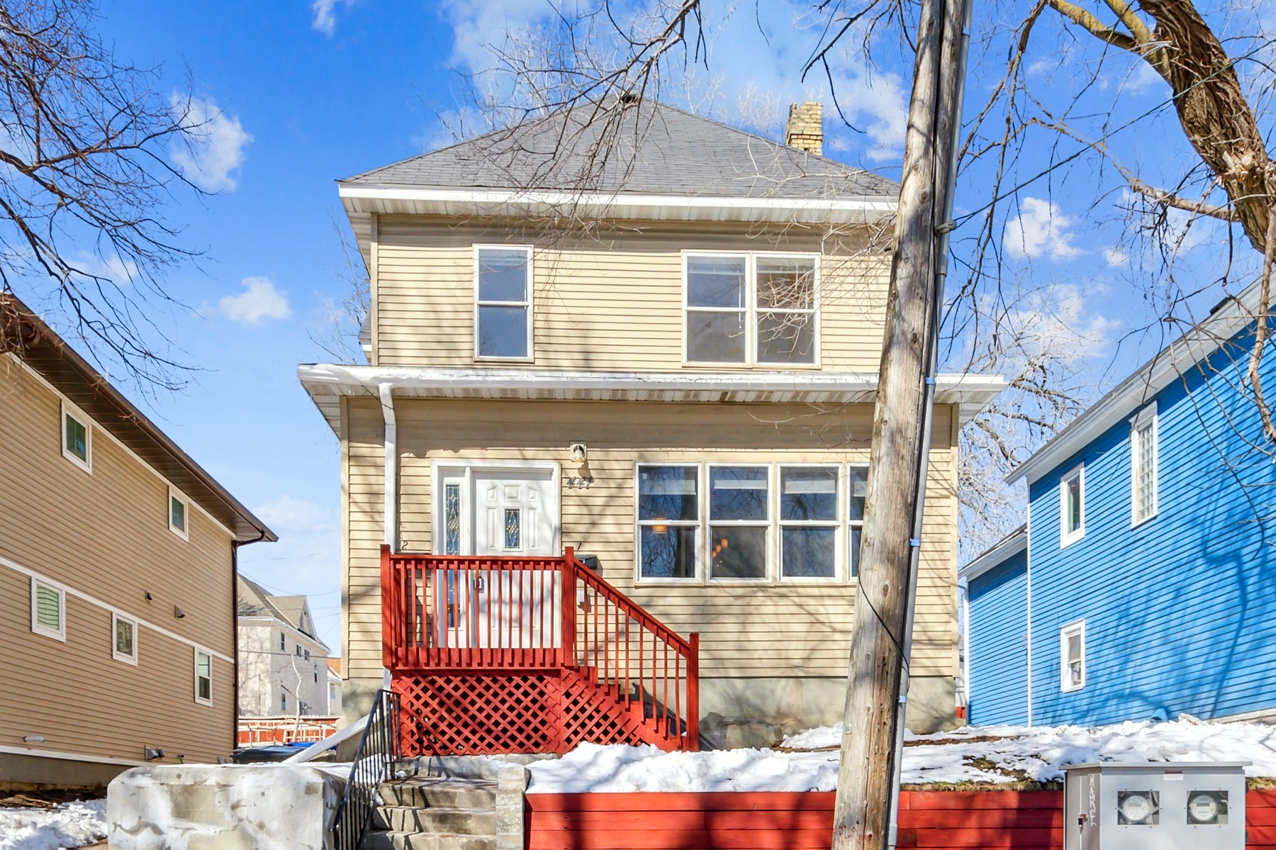 A restored red-brick apartment building sourced by Revolution Realty Group